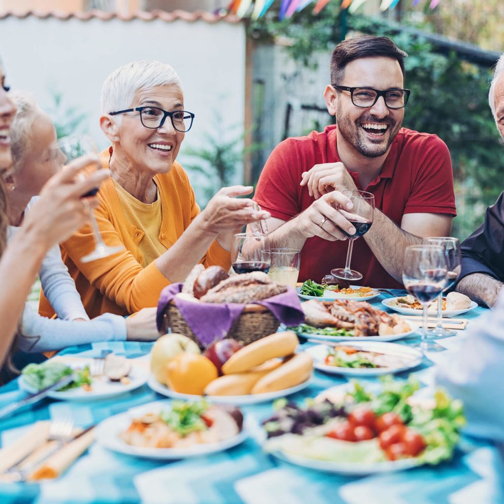 Family enjoying dinner together outside